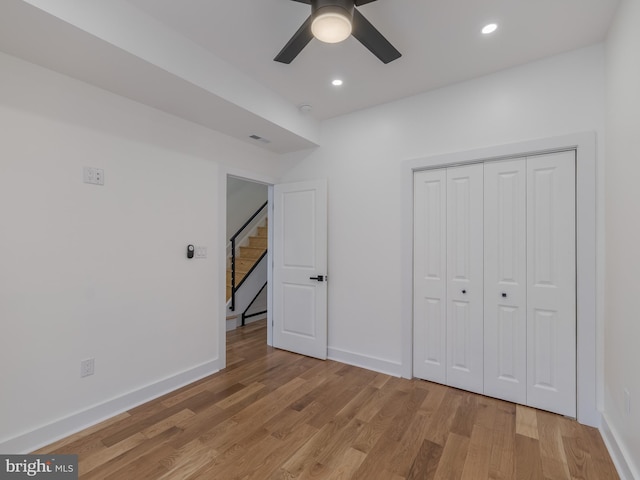 unfurnished bedroom with light wood finished floors, baseboards, recessed lighting, and ceiling fan