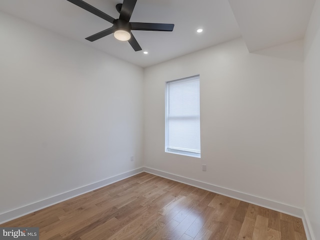 unfurnished room featuring light wood finished floors, baseboards, a ceiling fan, and recessed lighting