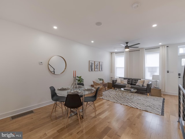 dining room featuring light wood-type flooring, recessed lighting, a ceiling fan, and baseboards