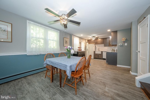 5330 Birney Hwy, Aston, PA 19014 - dining area with ceiling fan, baseboards, light wood finished floors, recessed lighting, and baseboard heating