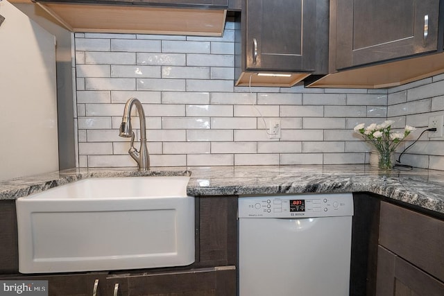 5330 Birney Hwy, Aston, PA 19014 - kitchen with dishwasher, a sink, dark brown cabinetry, backsplash, and light stone countertops