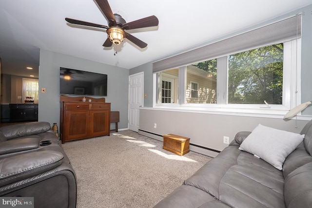 5330 Birney Hwy, Aston, PA 19014 - living area with a baseboard heating unit, a ceiling fan, light colored carpet, and baseboards