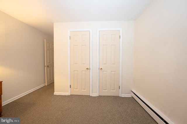 5330 Birney Hwy, Aston, PA 19014 - unfurnished bedroom featuring a baseboard radiator, dark colored carpet, and baseboards