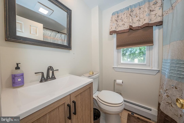 5330 Birney Hwy, Aston, PA 19014 - full bath with a baseboard heating unit, vanity, toilet, and tile patterned flooring