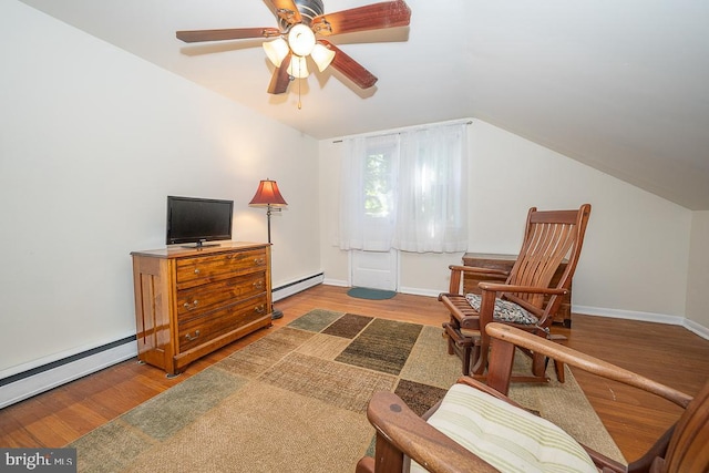 5330 Birney Hwy, Aston, PA 19014 - living area with a baseboard heating unit, wood finished floors, a ceiling fan, a baseboard radiator, and lofted ceiling