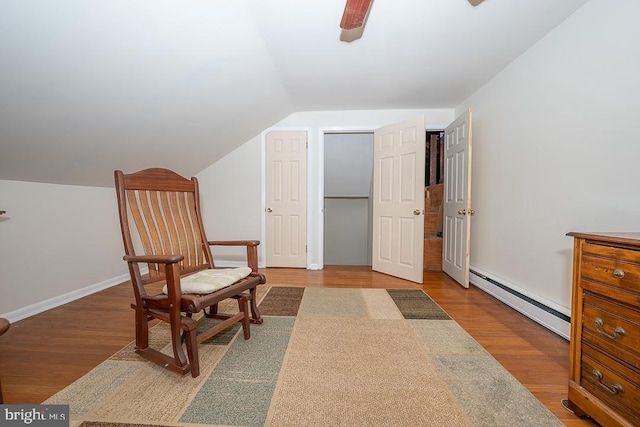 5330 Birney Hwy, Aston, PA 19014 - living area featuring a baseboard radiator, wood finished floors, lofted ceiling, a ceiling fan, and baseboards