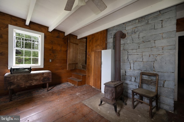 5143 S Middle Rd, Mount Jackson, VA 22842 - living room featuring a wood stove, beamed ceiling, hardwood / wood-style floors, and wood walls
