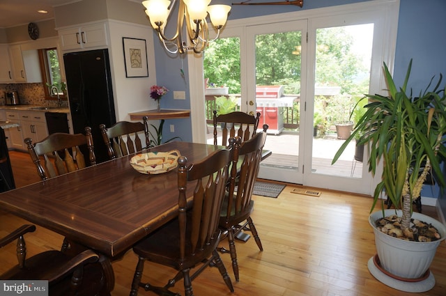 1331 Bradley Ave, Hummelstown, PA 17036 - dining area with a chandelier and light wood finished floors