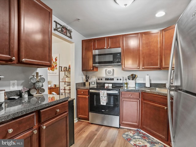 108 Timberlake Ter Unit 7, Stephens City, VA 22655 - kitchen featuring appliances with stainless steel finishes, light wood-type flooring, and dark stone counters
