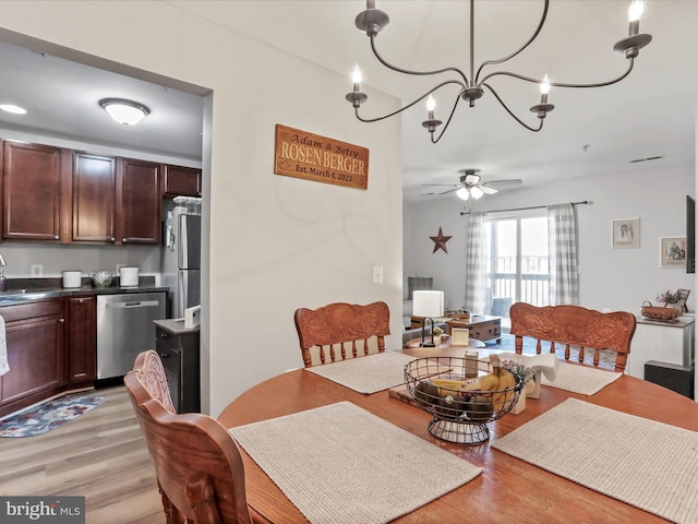 108 Timberlake Ter Unit 7, Stephens City, VA 22655 - dining space featuring light wood finished floors, a chandelier, and ceiling fan