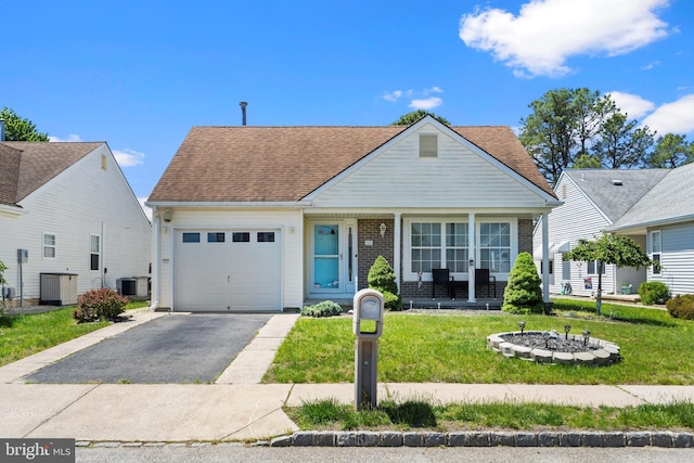 53 Stockport Dr, Toms River, NJ 08757 - view of front facade with an attached garage, driveway, central AC unit, a front yard, and a shingled roof