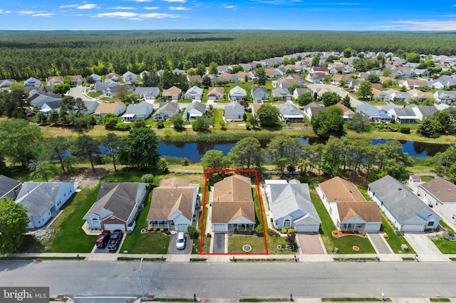 53 Stockport Dr, Toms River, NJ 08757 - aerial perspective of suburban area with a forest, property boundaries highlighted, and a large body of water