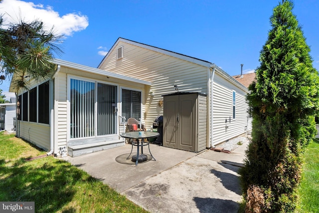53 Stockport Dr, Toms River, NJ 08757 - back of house with a patio, a sunroom, and an outbuilding
