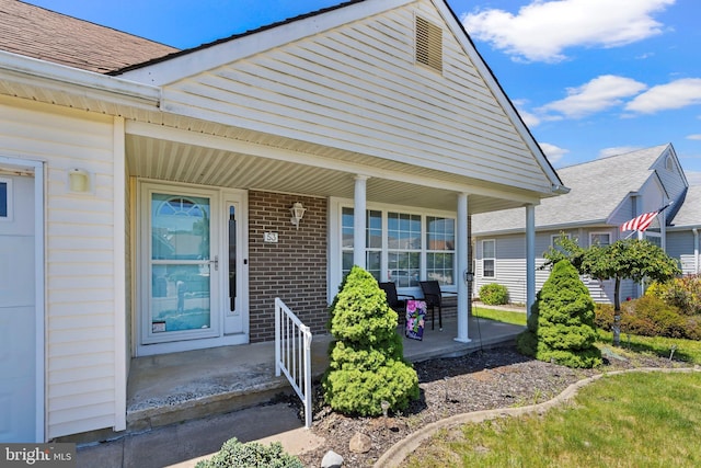 53 Stockport Dr, Toms River, NJ 08757 - property entrance with a porch and brick siding