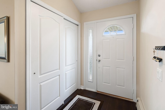 53 Stockport Dr, Toms River, NJ 08757 - entryway featuring dark wood-type flooring, baseboard heating, and baseboards