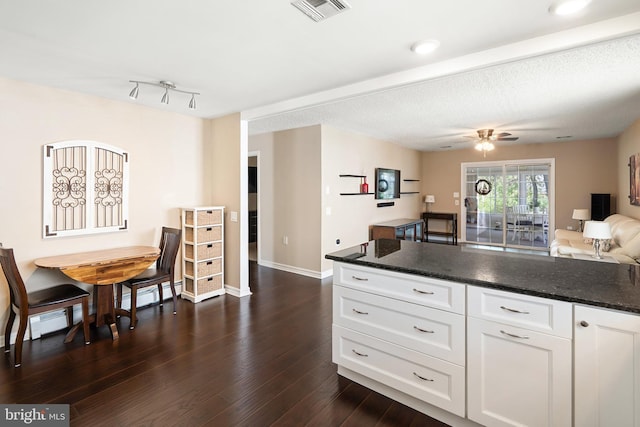 53 Stockport Dr, Toms River, NJ 08757 - kitchen with dark wood-style flooring, white cabinets, open floor plan, baseboards, and ceiling fan