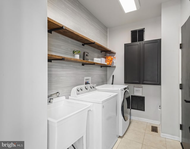 56 Thackery Ct, Sewell, NJ 08080 - washroom with washing machine and clothes dryer, light tile patterned flooring, baseboards, and cabinet space