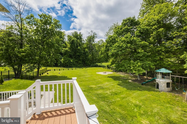 56 Thackery Ct, Sewell, NJ 08080 - view of yard with a playground, a deck, and view of scattered trees