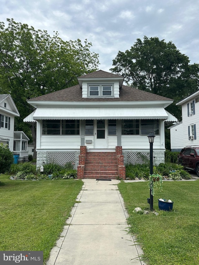 406 Myrtle St, Crisfield, MD 21817 - view of front facade with a front lawn, roof with shingles, entry steps, and stone siding