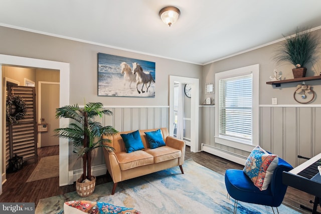 406 Myrtle St, Crisfield, MD 21817 - living area with baseboard heating, crown molding, wood finished floors, and wainscoting