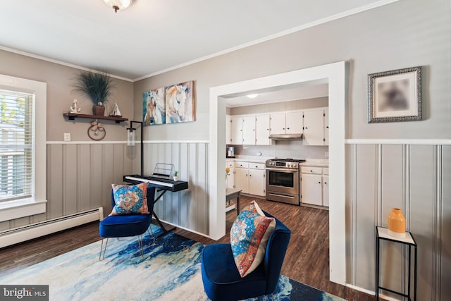 406 Myrtle St, Crisfield, MD 21817 - living area with dark wood-style flooring, baseboard heating, ornamental molding, and a wainscoted wall