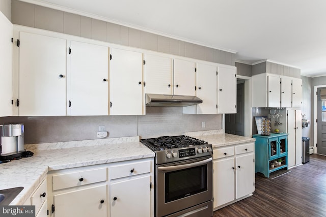 406 Myrtle St, Crisfield, MD 21817 - kitchen with stainless steel range with gas cooktop, under cabinet range hood, crown molding, dark wood-style floors, and white cabinets