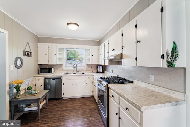 406 Myrtle St, Crisfield, MD 21817 - kitchen with stainless steel appliances, a sink, ornamental molding, white cabinetry, and under cabinet range hood