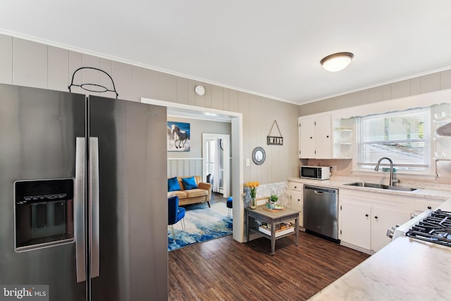 406 Myrtle St, Crisfield, MD 21817 - kitchen with appliances with stainless steel finishes, ornamental molding, a sink, dark wood finished floors, and white cabinets
