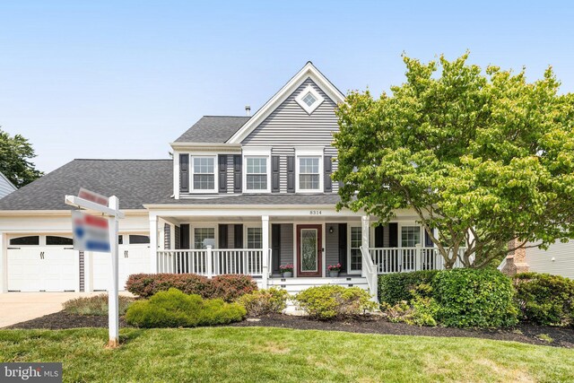 8314 Graceway Dr, Lorton, VA 22079 - view of front of house with an attached garage, covered porch, concrete driveway, and roof with shingles