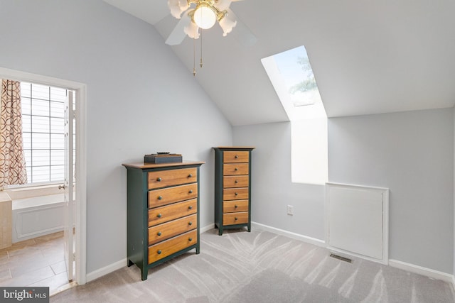 8314 Graceway Dr, Lorton, VA 22079 - bedroom with lofted ceiling, a skylight, baseboards, light colored carpet, and ceiling fan