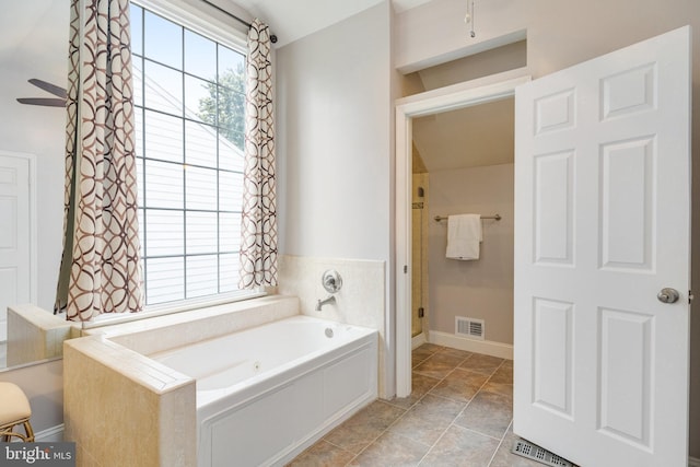 8314 Graceway Dr, Lorton, VA 22079 - bathroom with a garden tub, a ceiling fan, and baseboards