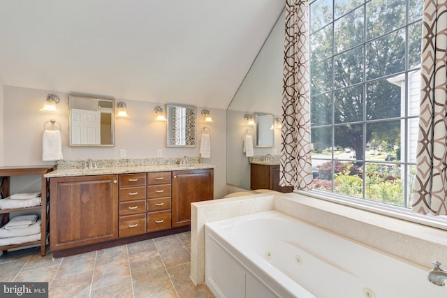 8314 Graceway Dr, Lorton, VA 22079 - bathroom with a jetted tub, double vanity, and vaulted ceiling
