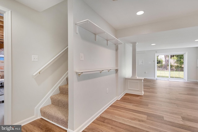 8314 Graceway Dr, Lorton, VA 22079 - stairs featuring ornate columns, wood finished floors, recessed lighting, and baseboards