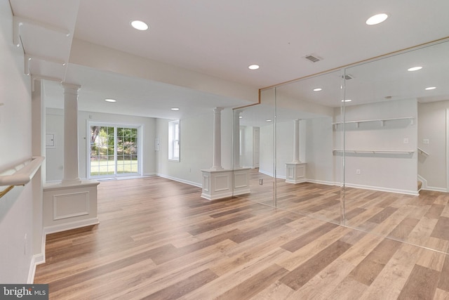 8314 Graceway Dr, Lorton, VA 22079 - empty room featuring decorative columns, light wood-type flooring, recessed lighting, and baseboards