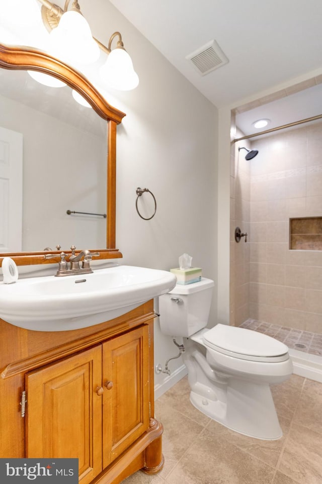 8314 Graceway Dr, Lorton, VA 22079 - bathroom featuring toilet, a shower stall, vanity, tile patterned floors, and baseboards