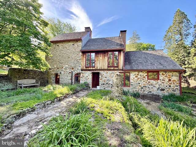 615 Westbourne Rd, West Chester, PA 19382 - back of property featuring stone siding and a chimney