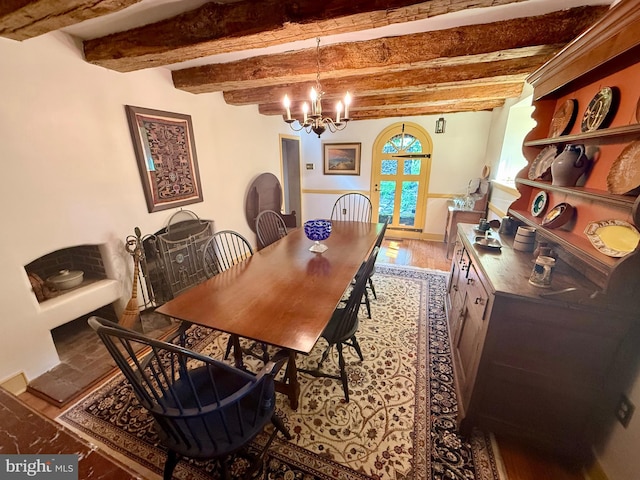615 Westbourne Rd, West Chester, PA 19382 - dining space with beamed ceiling, a chandelier, and french doors