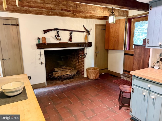 615 Westbourne Rd, West Chester, PA 19382 - living area featuring baseboards, beamed ceiling, and dark tile patterned flooring