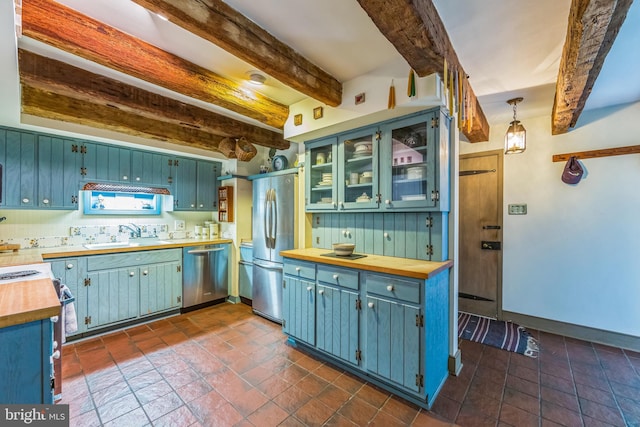 615 Westbourne Rd, West Chester, PA 19382 - kitchen featuring appliances with stainless steel finishes, a sink, butcher block countertops, beamed ceiling, and blue cabinets
