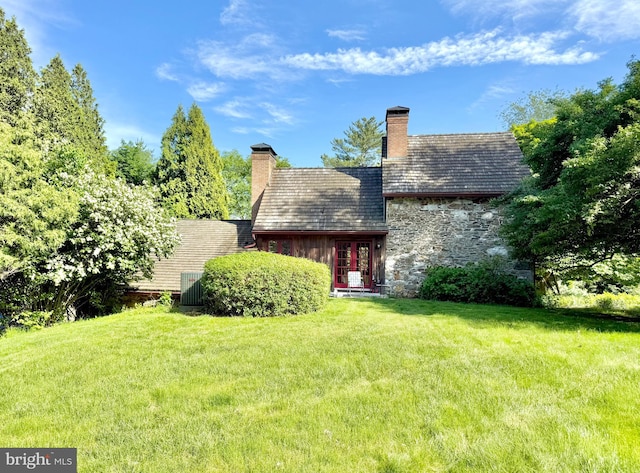 615 Westbourne Rd, West Chester, PA 19382 - back of house featuring a chimney and a lawn