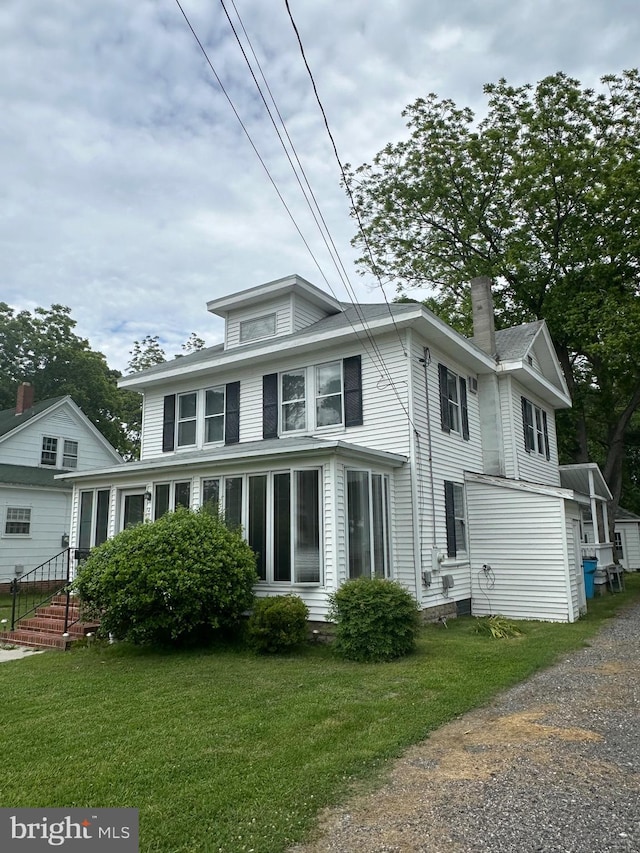 408 Myrtle St, Crisfield, MD 21817 - view of front of property featuring a chimney and a front yard