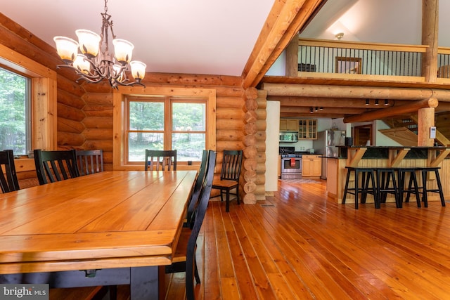 969 Hoyes Run Rd, Oakland, MD 21550 - dining room with rustic walls, a chandelier, and wood-type flooring