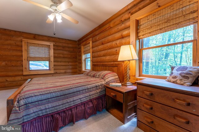 969 Hoyes Run Rd, Oakland, MD 21550 - carpeted bedroom featuring multiple windows and rustic walls