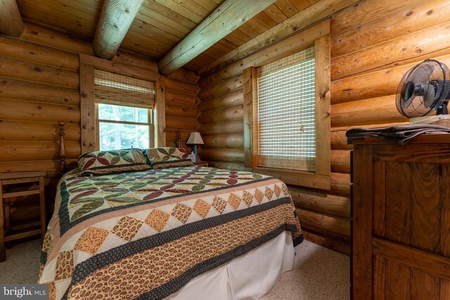 969 Hoyes Run Rd, Oakland, MD 21550 - carpeted bedroom with wooden ceiling with exposed beams and rustic walls