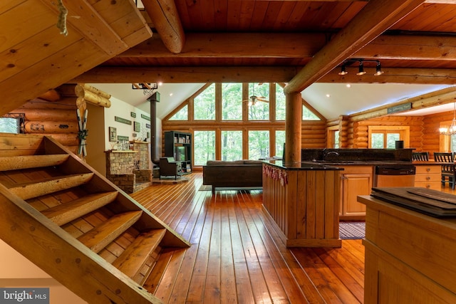969 Hoyes Run Rd, Oakland, MD 21550 - living room featuring rustic walls, track lighting, hardwood / wood-style flooring, stairs, and wooden ceiling