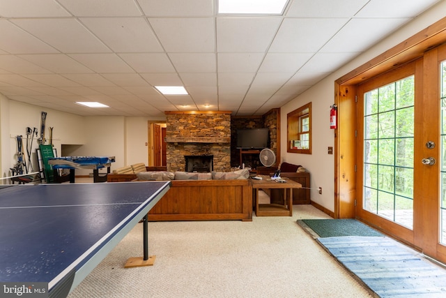 969 Hoyes Run Rd, Oakland, MD 21550 - rec room with carpet, a stone fireplace, a drop ceiling, and baseboards