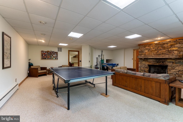 969 Hoyes Run Rd, Oakland, MD 21550 - playroom with a baseboard heating unit, light carpet, a stone fireplace, and a drop ceiling