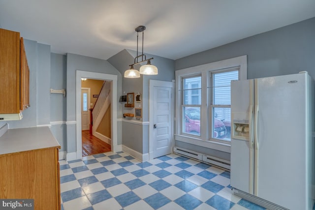 12 W Mispillion St, Harrington, DE 19952 - kitchen featuring white fridge with ice dispenser, light flooring, a baseboard radiator, baseboards, and brown cabinetry