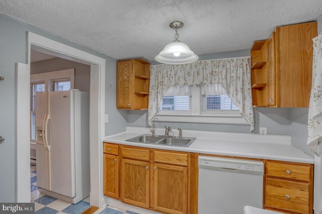 12 W Mispillion St, Harrington, DE 19952 - kitchen with white appliances, open shelves, a sink, light countertops, and light floors