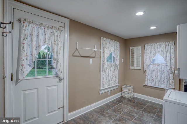 12 W Mispillion St, Harrington, DE 19952 - washroom with washer / dryer, baseboards, recessed lighting, and dark tile patterned floors